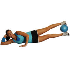 Lying Double Leg Raises With Medicine Ball